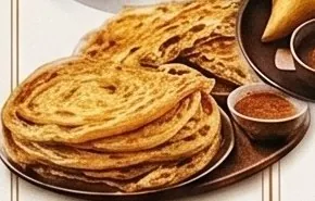Roti cane dengan mangkuk kecil kuah kari